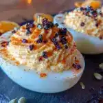 lightened-up spooky orange black deviled eggs - featured image